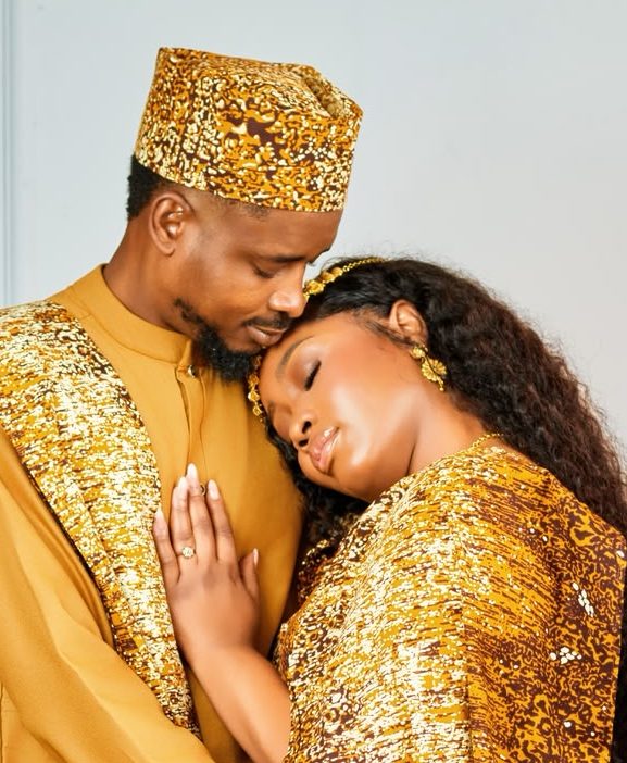 Winstina and Barrkela in matching gold and brown attire